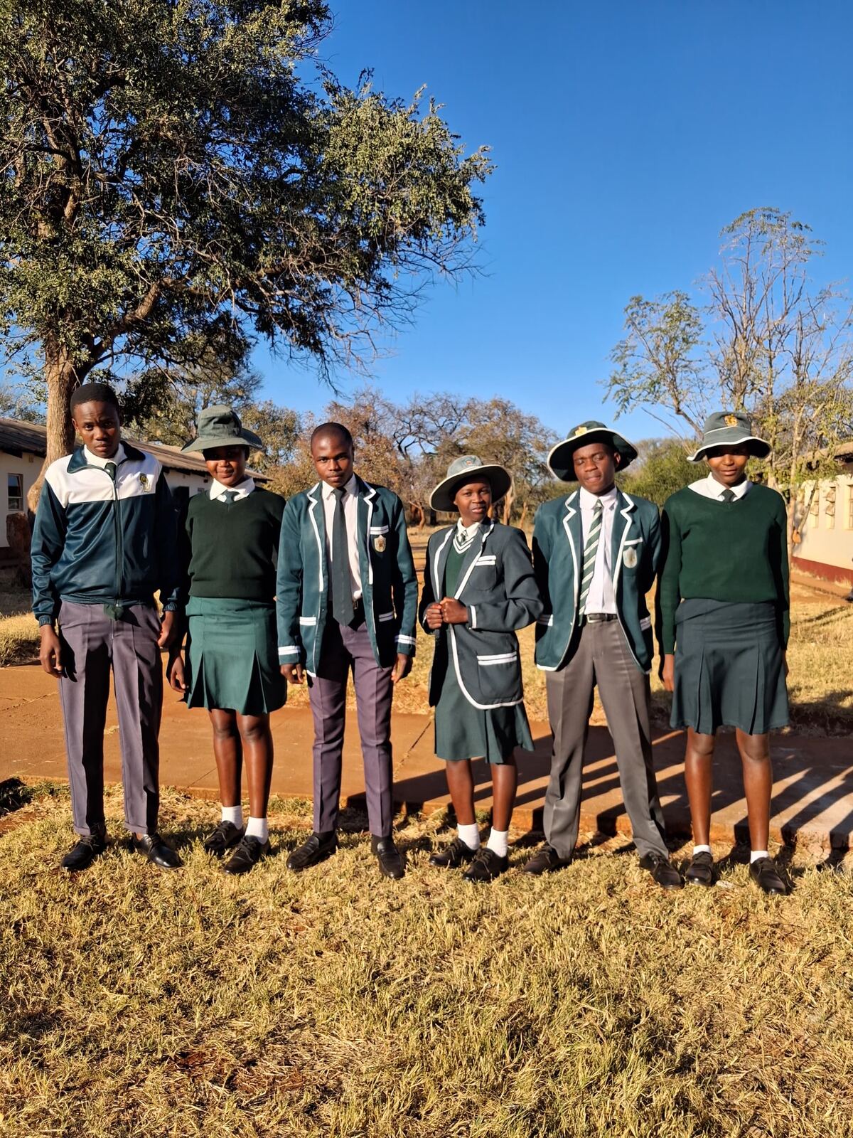 Learners in full Siganda Secondary School uniform